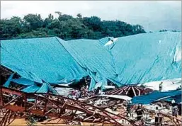  ?? CHUKWUEMEK­A NWANERI/AP ?? The wreckage of the church in Uyo, Nigeria, where hundreds were at a service Saturday.