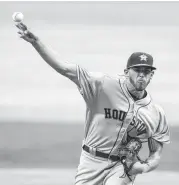  ?? Mike Zarrilli / Getty Images ?? The Astros’ Joe Musgrove delivers a pitch during Wednesday night’s game at Atlanta. For a recap, go to houstonchr­onicle.com/sports.