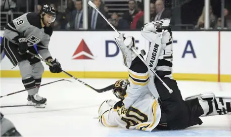  ?? ASSOCIATED PRESS ?? DENIED: Tuukka Rask sprawls to make a save on Alex Iafallo, one of his 23 stops during the Bruins’ 4-2 win against the Kings on Saturday night in Los Angeles.