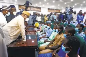  ?? AP ?? Students and teachers who were abducted by gunmen from the Government Science College Kagara two weeks ago meet with the state Gov. Abubakar Sani Bello (left) in Minna, Nigeria.