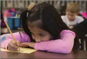  ?? ROGER NOMER — THE JOPLIN GLOBE ?? Odalys Tebalan works on an assignment at Fairview Elementary in Carthage, Mo. Millions of children are suddenly learning at home everything from reading and multiplica­tion to literature and calculus as a result of school closures.