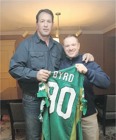  ?? BROCK SUNDERLAND ?? Dennis Byrd, left, was a hero to a young Brock Sunderland and a friend in later years before Byrd’s death in 2016. The two are holding the jersey cut off Byrd when he was paralyzed in a 1992 NFL game.