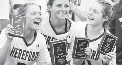  ?? BRIAN KRISTA/BALTIMORE SUN MEDIA GROUP ?? Hereford’s Stephanie Joyce, left, Libby May and Bella Cavallaro show off their plaques after winning the Baltimore County championsh­ip.