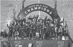  ?? KYLE ROBERTSON/COLUMBUS DISPATCH ?? Columbus Crew SC celebrates after winning the MLS Cup against the Seattle Sounders FC on Dec. 12, 2020.