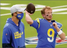  ?? (AP/Jae C. Hong) ?? John Wolford (9) is expected to start at quarterbac­k for the Los Angeles Rams today against the Seattle Seahawks if Jared Goff (left) cannot play. Goff underwent surgery after injuring his thumb two weeks ago.