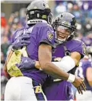  ?? KENNETH K. LAM/BALTIMORE SUN ?? The Ravens’ Willie Snead IV, right, celebrates with Lamar Jackson after a touchdown in the third quarter on Sunday.