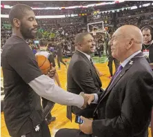  ?? STAFF PHOTO BY STUART CAHILL ?? HOW DO YOU DO: Kyrie Irving shakes hands with Dick Vitale before last night’s game at the Garden.