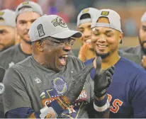  ?? DAVID J. PHILLIP/ASSOCIATED PRESS FILE PHOTO ?? Houston Astros manager Dusty Baker Jr. celebrates his team’s 4-1 World Series win Nov. 5 against the Philadelph­ia Phillies in Game 6 in Houston. Baker had won a World Series while playing for the Dodgers, but this year’s win was his first as manager.