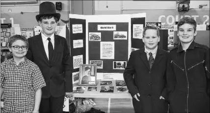 ?? LYNN CURWIN/TRURO DAILY NEWS ?? Oxford Regional Education Centre students, from left; Nate Adams, Robbie Dean, dressed as Winston Churchill; Connor Kontuk, dressed as Franklin Roosevelt; and Connor Rideout, dressed as a  ghter pilot, combined their e orts to create a project on the...