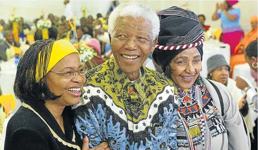  ?? Picture: AFP ?? Nelson Mandela celebrates his 86th birthday with his wife Graca Machel, left, and ex -wife Winnie Madikizela Mandela,right, in his rural home town of Qunu on July18 2004.