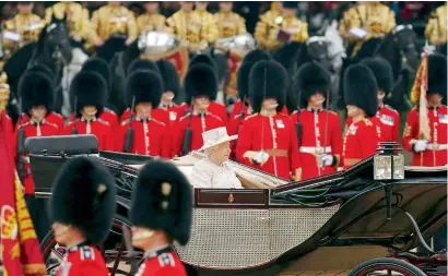  ?? Reuters ?? Queen Elizabeth inspects troops at the annual Trooping the Colour ceremony in central London on Saturday. —