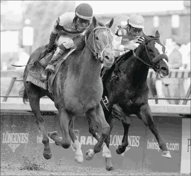  ?? BARBARA D. LIVINGSTON ?? Bodemeiste­r (right) finishes second to I’ll Have Another in the 2012 Kentucky Derby.