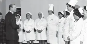  ??  ?? ADVICE:
The Duke of Edinburgh meets kitchen staff at the YMCA in 1978.