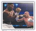  ?? ?? Oleksandr Usyk lands a combinatio­n on Anthony Joshua at Tottenham Hotspur Stadium.