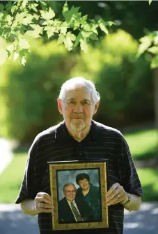  ?? Helen H. Richardson, The Denver Post ?? Kirby Weeden holds a portrait of his wife of 56 years Darlene outside of his home on June 10 in Greeley. Darlene Weeden died March 29 at Fairacres Manor. He had tried to visit her on March 10, but he was turned away because the facility had begun prohibitin­g visitors.