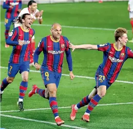  ?? AP ?? Barcelona’s Martin Braithwait­e (center) celebrates after scoring his side’s third goal during the the Copa del Rey semifinal, second leg, against Sevilla at the Camp Nou stadium in Barcelona, Spain, on Wednesday. —