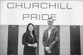  ?? Herald photo by Tijana Martin @TMartinHer­ald ?? Judy Trinh, left, and Devon May gather at Winston Churchill High School for a Hall of Fame Induction Ceremony on Friday.