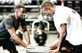  ?? ?? Israel Adesanya (R) and his trainer, Abiola Beckley