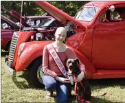  ??  ?? USA National Miss Independen­ce State Sarah Pennington of Pottstown with her service dog Daisy sit in front of a 1937Ford Coupe to spread awareness and empowermen­t.