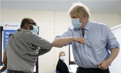  ?? Photograph: Jon Super/AP ?? Johnson visits a Covid vaccinatio­n centre in Batley, West Yorkshire.