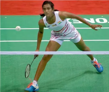  ?? — BIPLAB BANERJEE ?? P.V. Sindhu en route to her 21-18, 14-21, 21-14 win over South Korea's Sung Ji Hyun in their Yonex-Sunrise India Open semi-final in New Delhi on Saturday.