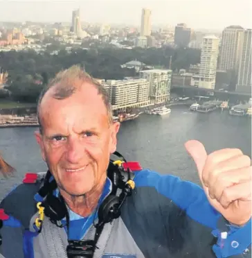  ??  ?? Bob Lisle, pictured after climbing Sydney Harbour Bridge, Australia