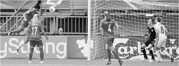  ??  ?? Denmark’s forward Nadia Nadim (left) heads the ball to score a goal during the quarter-final UEFA Women’s Euro football match between Germany and Denmark at Stadium Sparta Rotterdam in Rotterdam. — AFP photo