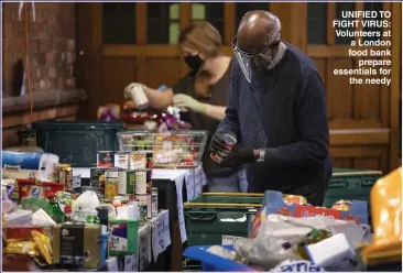  ?? Picture: DAN KITWOOD/ GETTY ?? UNIFIED TO FIGHT VIRUS: Volunteers at a London food bank prepare essentials for the needy