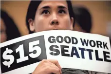  ?? AP FILE PHOTO ?? In 2014, Seattle City Council voted to incrementa­lly raise the minimum wage to $15 per hour for all workers by 2021.