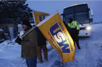  ?? MARTA IWANEK/TORONTO STAR FILE PHOTO ?? Crown Holdings workers block a bus carrying scab workers in February. Without anti-scab legislatio­n, the company can stagger on with replacemen­t workers until the union is utterly quashed, says Rosie DiManno.