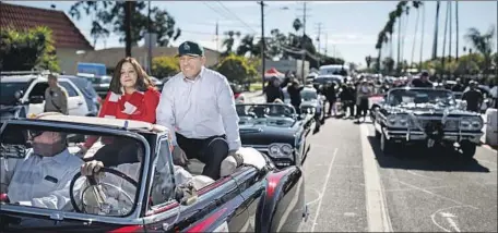  ?? Marcus Yam Los Angeles Times ?? ALEX AND VIVIAN VILLANUEVA at an East L.A. parade. “My career has been killed so many times ... I keep rising from the dead.”