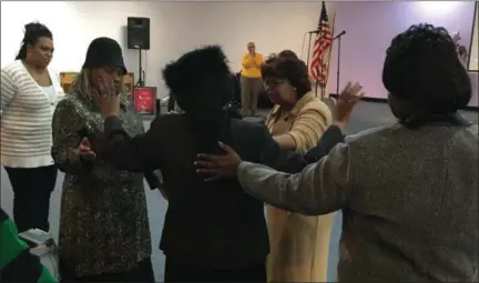  ?? RICHARD PAYERCHIN — THE MORNING JOURNAL ?? Pastor Gwendolyn Gilmore, second from right, and other worshipers pray over the Rev. Addie L. Nolen as part of the Annual Thanksgivi­ng Unity Service held Nov. 22, at Full Gospel Faith Fellowship, 1901 North Ridge Road, Lorain. About two dozen people gathered in the morning to give thanks and praise to God before celebratin­g Thanksgivi­ng later that day.