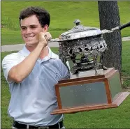  ?? Special to the Democrat-Gazette/ROBERT YATES ?? Little Rock’s Miles Smith displays his trophy after defeating Luke Cornett of Drasco 3-and-2 in the final of the 52nd annual Arkansas State Golf Associatio­n Men’s Match Play Championsh­ip on Sunday morning at Harbor Oaks Golf Club.