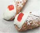  ?? MICHAEL SEARS/MILWAUKEE JOURNAL SENTINEL ?? Festa Italiana will again have its cannoli-eating contest this year during the festival, starting Friday at the lakefront. Festival-goers can buy cannoli (and much more) to eat noncompeti­tively, too.