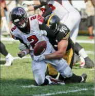  ?? GENE J. PUSKAR — THE ASSOCIATED PRESS ?? Atlanta Falcons quarterbac­k Matt Ryan (2) is sacked by Pittsburgh Steelers linebacker T.J. Watt (90) as he fumbles the football during the fourth quarter of last Sunday’s game.