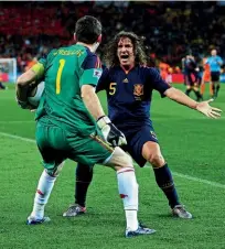  ??  ?? Historic moment… Casillas celebrates winning the 2010 World Cup against the Netherland­s with Carles Puyol