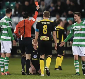  ??  ?? John Russell receives his marching orders from referee Neil Doyle. Pic: Matt Browne/ Sportsfile