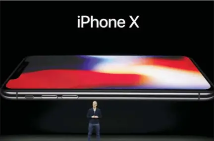  ?? THE ASSOCIATED PRESS ?? Apple CEO Tim Cook announces the new iPhone X at the Steve Jobs Theater on the new Apple campus Tuesday in Cupertino, Calif.