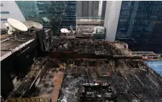  ?? Reuters ?? Friday’s fire started in a restaurant that had a roof made of flammable plastic and bamboo