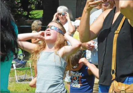  ?? PHOTOS BY LEAH MCDONALD — ONEIDA DAILY DISPATCH ?? Hundreds attend the Great American Solar Eclipse viewing party at the future site of the Oneida Public Library on Monday.