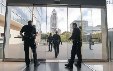  ?? Mark Boster Los Angeles Times ?? THE UNION representi­ng rank-and-file LAPD officers is leading the charge in the renewed scrutiny of how the department uses its roughly 9,900 cops. Above, LAPD headquarte­rs in downtown Los Angeles.