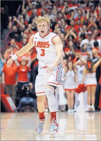  ?? JIM THOMPSON/JOURNAL ?? UNM point guard Hugh Greenwood celebrates after he hit a 3-pointer during the second half of the Lobos game against Southern Cal on Wednesday in the Pit. Greenwood had 17 point on the night.