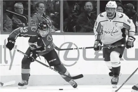  ??  ?? Avs defenseman Samuel Girard, left, is only 19, but coach Jared Bednar already calls him “an impact player for us.”