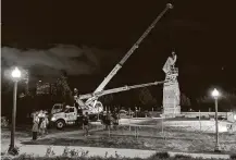  ?? Derek R. Henkle / AFP/Getty Images ?? Chicago’s mayor ordered removal of Christophe­r Columbus statues Friday in Grant Park and Arrigo Park.