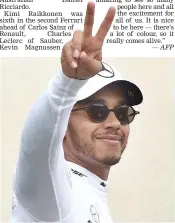  ?? — AFP ?? Mercedes’ Lewis Hamilton celebrates taking pole position for Sunday’s French GP at the Circuit Paul Ricard in Le Castellet on Saturday.