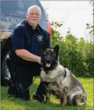  ?? MEDIANEWS GROUP FILE PHOTO ?? Chester County Sheriff’s Deputy Lt. Harry McKinney, with his K-9 Afta, in a file photo. McKinney is accused of inflating overtime requests in the county as compensati­on for his care of the K-9s he maintains.