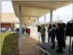  ??  ?? North Penn High School students listen as the names of victims of a Feb. 14 shooting in Parkland, Florida, are read during a national student walkout to protest gun violence Wednesday.