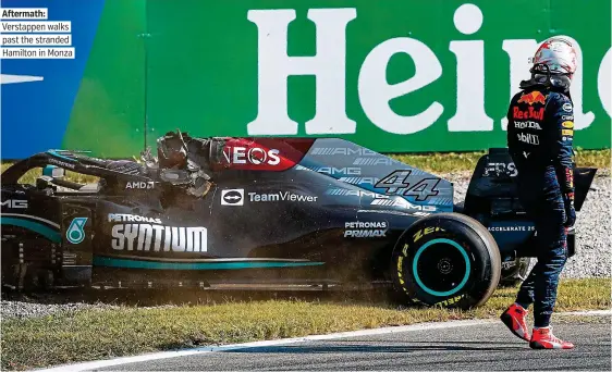  ?? ?? Aftermath: Verstappen walks past the stranded Hamilton in Monza