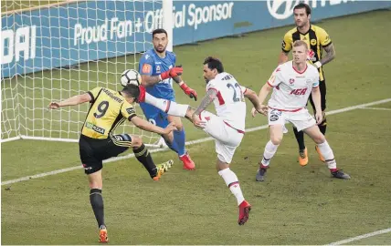  ?? Getty Images ?? Andrija Kaludjerov­ic almost copped a nasty boot to the head from Adelaide’s Ersan Gulum last night.