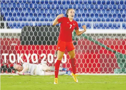  ?? EDGAR SU/REUTERS ?? Julia Grosso celebrates scoring to win the penalty shootout and capture Canada's first Olympic gold in women's soccer.